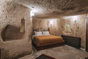 En eller flere senge i et værelse på Sora Cave Hotel