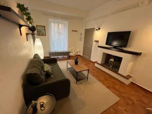Televízia a/alebo spoločenská miestnosť v ubytovaní T3 au coeur de la vieille ville de Porto-Vecchio