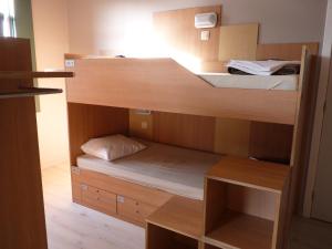 a room with two bunk beds in a room at Sleep Well Youth Hostel in Brussels