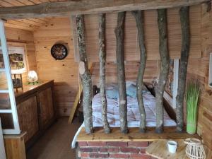 Postel nebo postele na pokoji v ubytování Maisonnette perchée au cœur de la nature