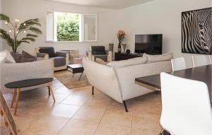 a living room with couches and a table at Gorgeous Home In Bédarieux in Bédarieux