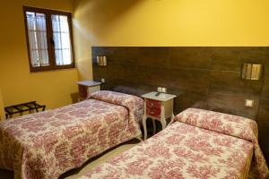 Postel nebo postele na pokoji v ubytování Hotel Un lugar en la Vecilla