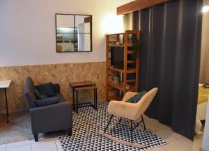 Posedenie v ubytovaní Ô Toulouse - Appart cosy - Wifi + 4 fotografie
