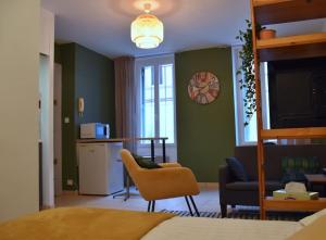 Kuchyňa alebo kuchynka v ubytovaní Ô Toulouse - Appart cosy - Wifi