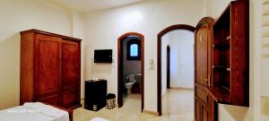 a room with a bedroom with a dresser and a mirror at Moon fourteen2 in Luxor