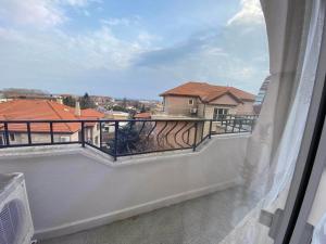 a balcony with a view of a building at Wild Cherry Apartments in St. St. Constantine and Helena