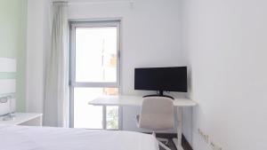 A television and/or entertainment centre at MEDANO4YOU La Terraza Los Martines