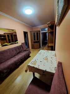 a living room with a couch and a coffee table at Zatyshok in Chernivtsi