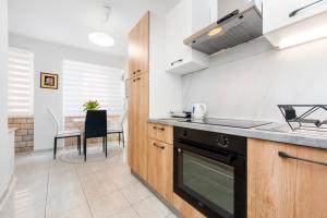 a kitchen with a sink and a stove top oven at Studio Apartment Bisaku in Rovinj