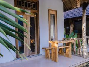 En balkon eller terrasse på KUBU YANG COTTAGE