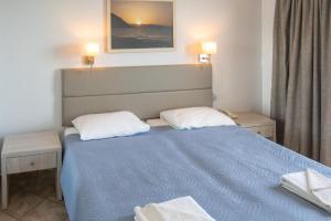 Postel nebo postele na pokoji v ubytování Aristea Hotel