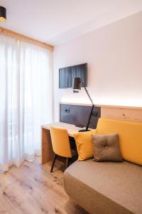 TV a/nebo společenská místnost v ubytování Hotel Piccola Baita