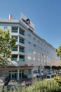 a building with a sign on top of it at Rafaelhoteles Atocha in Madrid +23 photos