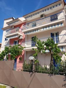 a building with balconies on the side of it at Mare blu Lefkada in Nydri
