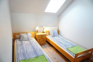 Ein Bett oder Betten in einem Zimmer der Unterkunft Insko Home & Sauna