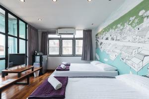 Postel nebo postele na pokoji v ubytování 99 Hostel Khaosan