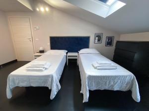 A bed or beds in a room at Le Stanze di Gianmarmo - Via di Mezzo