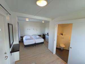 Säng eller sängar i ett rum på Guesthouse Storu-Laugar