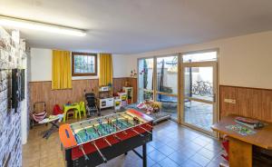 a living room with a table and a room with a table at Residence Alpina Comfort Nr 6 in Tesimo