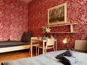 a bedroom with a bed and a table with a desk at Apartment with balcony in Lengerich in Lengerich