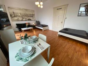 a living room with a white table and chairs at Apartment with balcony in Lengerich in Lengerich