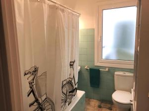 a bathroom with a shower curtain with a bicycle on it at Azkoitia In the heart of the Basque Country in Azcoitia