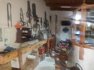 a room with a bunch of tools hanging on the wall at Karoo Manor Guesthouse and Restaurant in Richmond