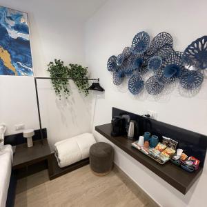 a room with a counter with blue plates on the wall at Namuri Luxury Rooms in Taormina