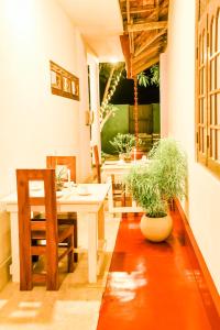 a dining room with a table and chairs and a table and chairsktop at Villa Paradise Ocean in Bentota