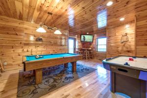 a game room with pool tables in a cabin at Hemlock Manor in Gatlinburg