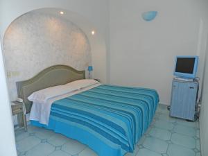 Postel nebo postele na pokoji v ubytování Hotel Holiday