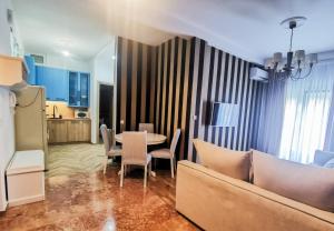 a living room with a couch and a table at Maison De Prestige in Chalkida