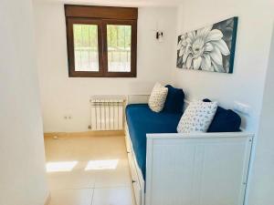 a bedroom with a blue bed and a window at Moraira Escape with Private Pool 1 Bed Sleeps 2 in Moraira +20 photos