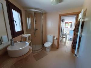 a bathroom with a sink and a toilet and a shower at Moraira Escape with Private Pool 1 Bed Sleeps 2 in Moraira