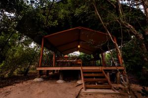 a tree house in the middle of a forest at Wild Trails Yala by Suri in Yala