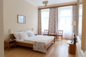 Postel nebo postele na pokoji v ubytování Hotel Orion