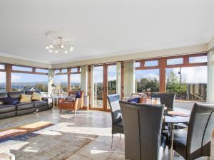 a living room with a table and chairs at Rose Cottage in Muff