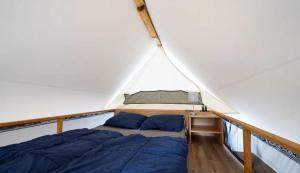 Postel nebo postele na pokoji v ubytování EuroParcs Zilverstrand