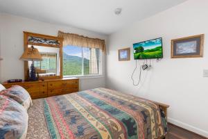 En eller flere senge i et værelse på Deer Ridge Mountain Resort C301 + 35 billeder