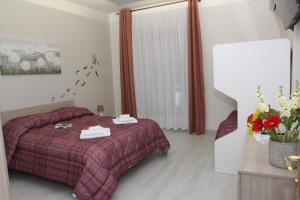 Postel nebo postele na pokoji v ubytování PONTE VALLE B&B POMPEI