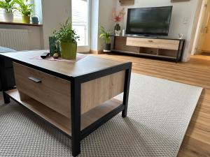 Televízia a/alebo spoločenská miestnosť v ubytovaní Traunkai Apartments Bad Ischl