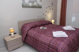 Postel nebo postele na pokoji v ubytování PONTE VALLE B&B POMPEI