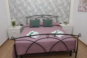 Postel nebo postele na pokoji v ubytování PONTE VALLE B&B POMPEI