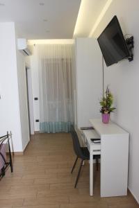 TV a/nebo společenská místnost v ubytování PONTE VALLE B&B POMPEI