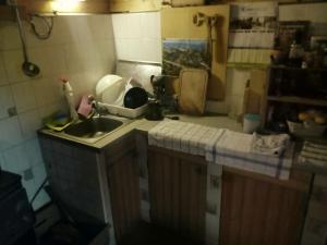 a kitchen with a sink and a counter top at A Cottage in the Alps for hiking, cycling, skiing in Jesenice