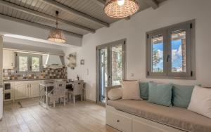 a living room with a couch and a kitchen at Happy Babi in Adamantas