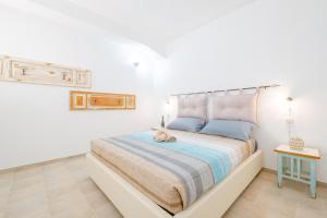 Postel nebo postele na pokoji v ubytování Villa Palamita Luxury - Specchia