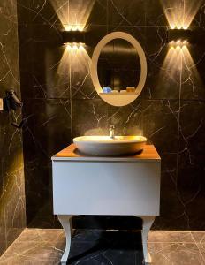 a bathroom with a sink and a mirror at Safir Hotels Silivri in Silivri