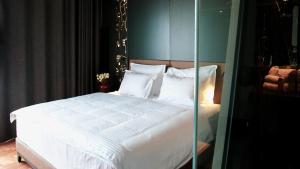Postel nebo postele na pokoji v ubytování Arka Art Hotel