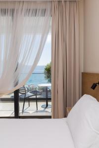 Postel nebo postele na pokoji v ubytování B&B Champagne, Vlore Bay